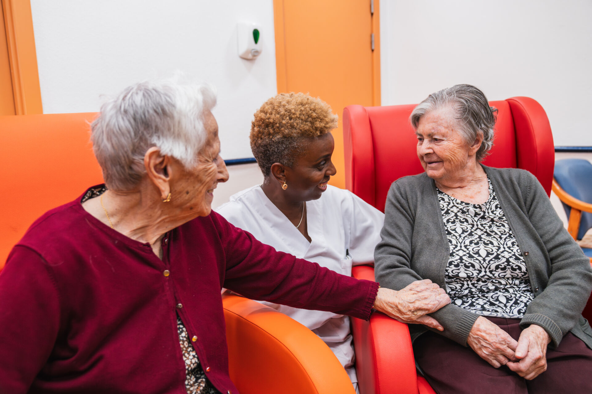 Residents enjoying relaxed communal spaces with personal care services